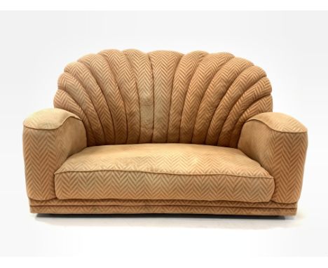 Early 20th century Art Deco shell back two seat sofa, upholstered in salmon herringbone fabric, raised on metal castors, W150