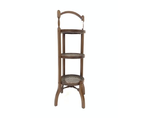 Edwardian walnut three tier cane cake stand, each having a circular cane panel, H83cm - Condition Report 