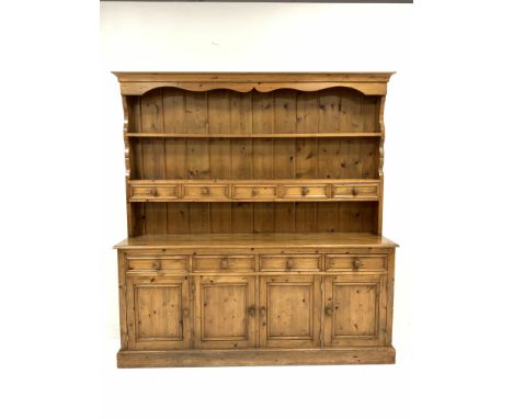 Pine four drawer kitchen dresser, two height plate rack with five spice drawers, four drawers and four panelled cupboards und