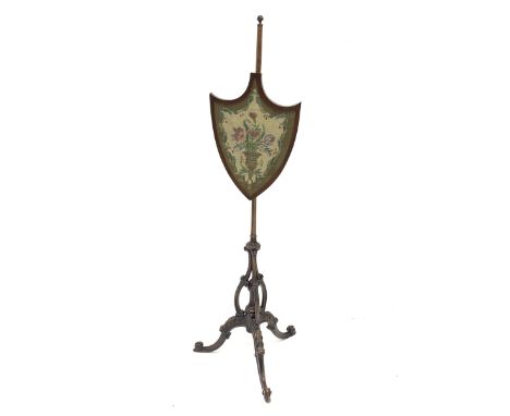 Late 19th century walnut pole screen, shield shaped screen with needle work panel, carved c scroll supports sat on turned and