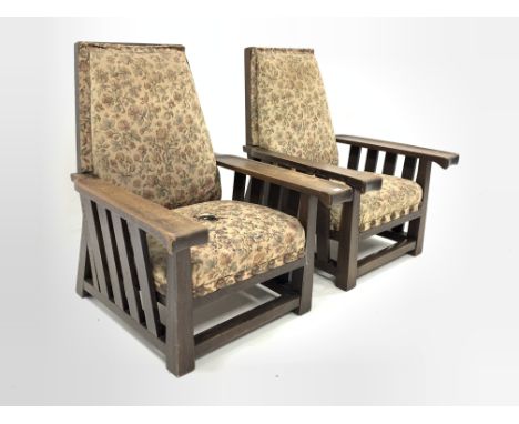 Two large early 20th century oak framed easy chairs, with moulded open arms, slatted sides, upholstered seat and back panel, 