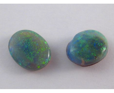 Two loose polished opals, total weight approx 0,5 gms (2.5 carats), larger stone approx 7.3 x 9.5mm, VAT will be added to the