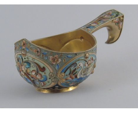 A Russian silver gilt kovsh decorated with panels of swans and flowers in shaded cloisonne enamels. 6th. Moscow Artel, Moscow