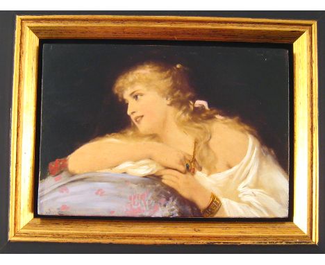 An oil on panel portrait of a young girl resting against a cushion. 13.5x9cm., frame 20x16cm. 