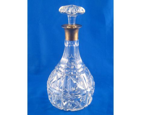 A silver mounted cut glass decanter with mushroom stopper. London 1933. Ht.26cm. 