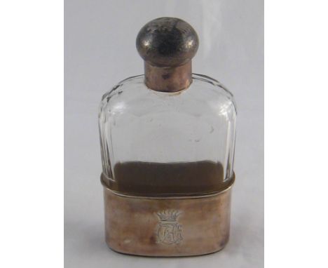 A Victorian silver mounted faceted glass hip flask and cup with  chamois cover. London, 1883.