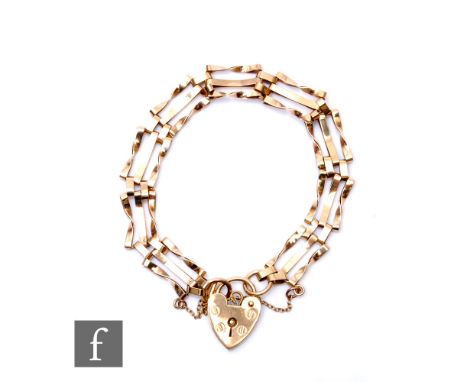 A 9ct three bar gate bracelet, weight 7.4g, terminating in padlock fastener. 
