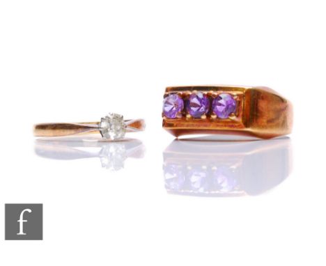 An 18ct diamond solitaire ring, weight 1.8g, with a 14ct three stone amethyst ring, weight 4g. (2) 