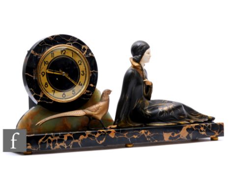 An Art Deco style French clock with a reclining girl and a pheasant, dial on black rectangular base, width 66cm. 