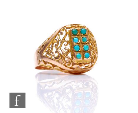 A 14ct turquoise set ring comprising two rows of four vertically set stones to pierced shoulders, weight 3.7g, ring size P. 