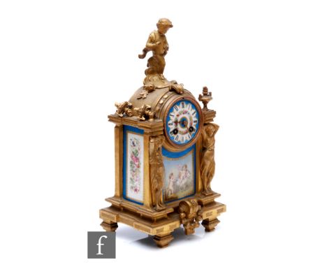 A 19th Century French gilt mantle clock, surmounted with a cherub over Sevres style panels and dial detailed with cherubs one