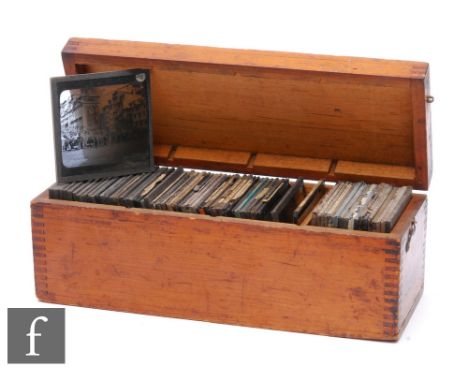 A wooden case of early magic lantern slides, various subjects. (qty) 