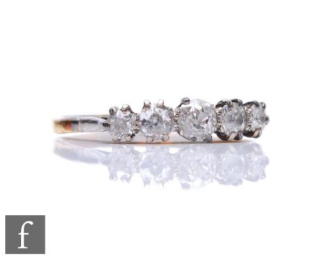 A mid 20th Century 18ct graduated diamond five stone ring, claw set old cut stones, largest approximately 0.33ct, to knife ed