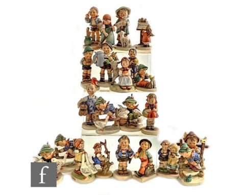 A collection of twenty-three Goebel Hummel figures, including Apple Tree Girl, Goose Girl, Merry Wanderer, For Father and man