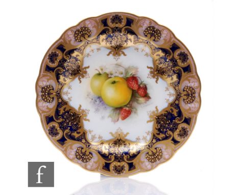 A Royal Worcester cabinet plate decorated by R. Sebright with hand painted apples and strawberries to the centre against a ro