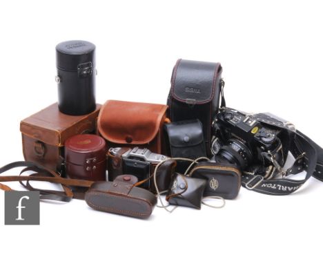 A Contax 35mm camera, a Cortina camera, telephoto lens, Zeiss lens and accessories. (qty) 