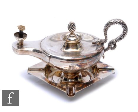 A hallmarked silver table lighter modelled as an Aladdin's lamp terminating in coiled snake handle, damaged, with a silver as