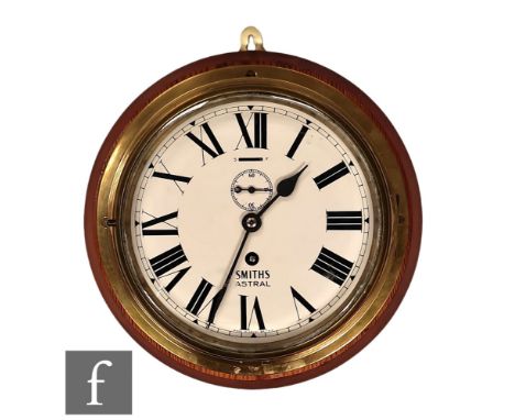 A 20th Century brass bulk head Smiths Astral clock mounted on a wooden base, key wind, 20cm dial.  Provenance - Reputed by th