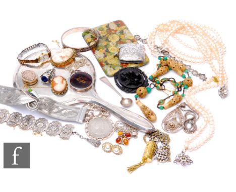 A small parcel lot of assorted costume jewellery to include beads, earrings. a silver backed hand mirror, silver vesta case, 