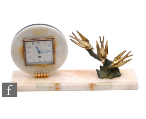An Art Deco alabaster mantle clock, the circular movement set with a square dial and eight day movement, with three perched g