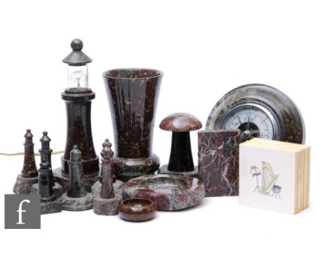 A collection of 20th Century serpentine ware to include light house models, one converted to electricity, height 27cm, a vase