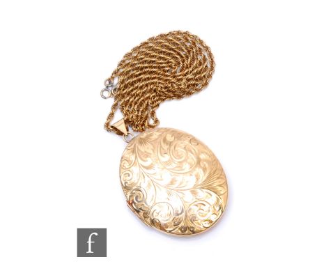 A 9ct hallmarked oval locket with engraved foliate decoration to front and suspended from a 9ct rope chain, total weight 32.5
