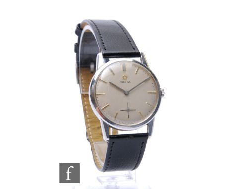 A mid 20th Century stainless steel Omega manual wind wrist watch, gilt batons to a circular silvered dial, case diameter 33mm