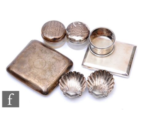 A small parcel lot of hallmarked silver items to include a pair of silver topped rouge pots, two cigarette cases, two shell s