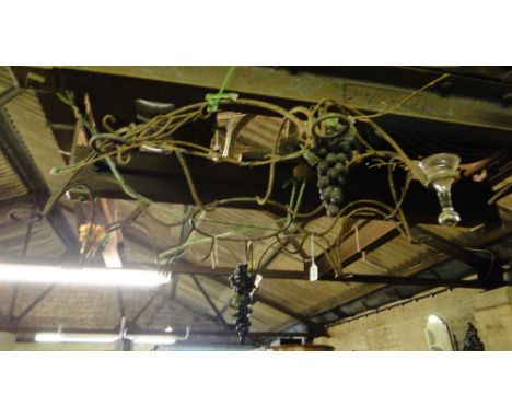 A wrought-iron hanging tea light/candle chandelier with grape and vine decoration.