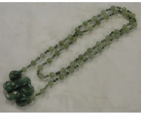 A Green jade pendant & chain