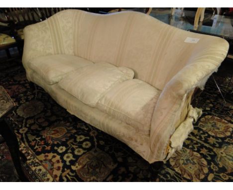 A Victorian upholstered 3-seater sofa with shaped back raised on turned legs, (for re-upholstering).