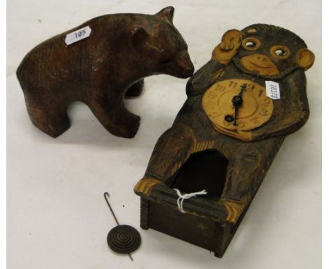 A Carved wood monkey figure clock with moving eyes, & a carved bear