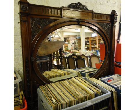 A Victorian carved and panelled mahogany over mantel with inset over mirror.