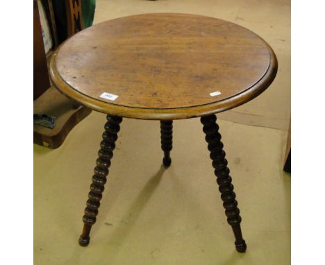 A 19th century mahogany gypsy table on bobbin turned legs.