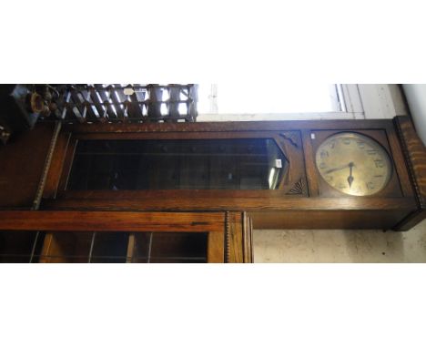 A 1930s oak 3-train long cased clock with brass dial.