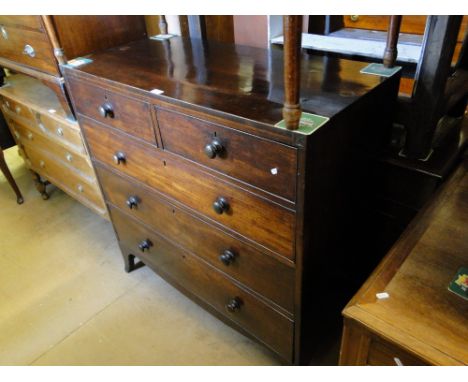 A Georgian mahogany chest of 2 short and 3 long drawers on bracket feet.