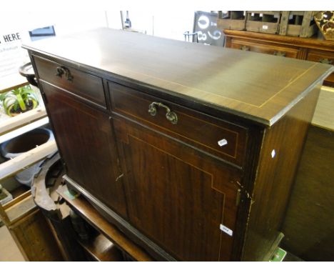 A reproduction mahogany and satinwood strung sideboard of small size with 2 drawers and cupboards under, on bracket feet.
