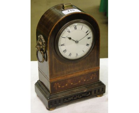 An Edwardian dome top inlaid mantel clock with lion mask ring handles & French movement