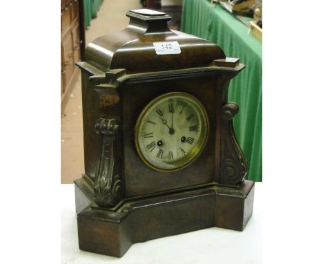 A Carved walnut cased 2 train mantel clock