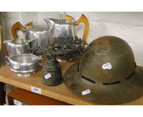 Tin helmet, bell, & a Picquot Ware tea set