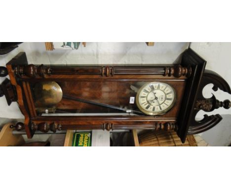 Ornate mahogany cased wall clock with enamel dial