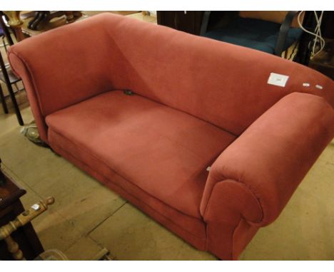 An Edwardian upholstered single drop end sofa.