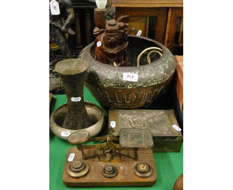 An Eastern copper bowl with design of animals, carved hardwood Eastern figure lamp, postal scale etc