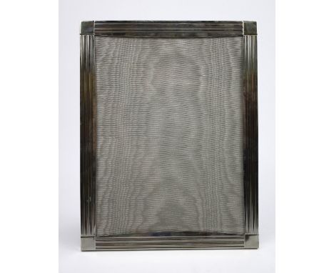 A silver photograph frame with ribbed border decoration and strut back support, London 2008, 18cm X 23cm. Markers mark for Ri