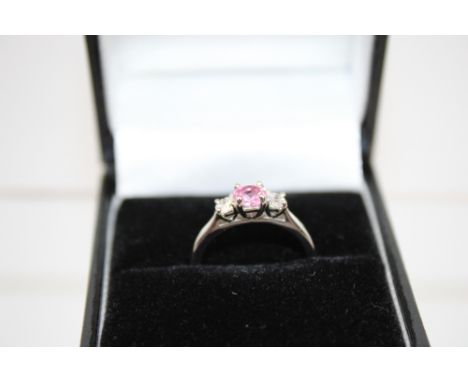 Pink Sapphire and Diamond Ring, set with circular cut pink sapphire , set between two brilliant cut diamonds, mounted in plat