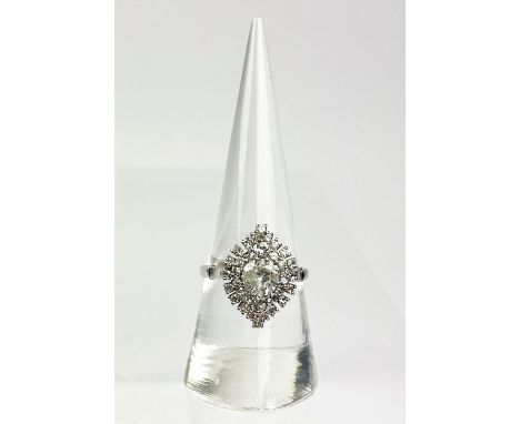 Diamond cluster ring, set with a brilliant cut diamond within a surround of single cut diamonds. Size P1/2 , 18-carat white g