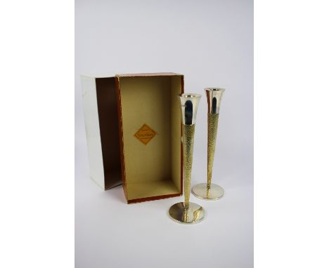 A pair of silver and silver gilt candlesticks , marked London 1977, Markers mark for Richard Lawrence Geere. approx.260 grams