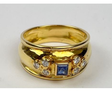 A Sapphire and Diamond ring, set with a square sapphire between clusters of brilliant-cut diamonds, Ring size T, ring weight 