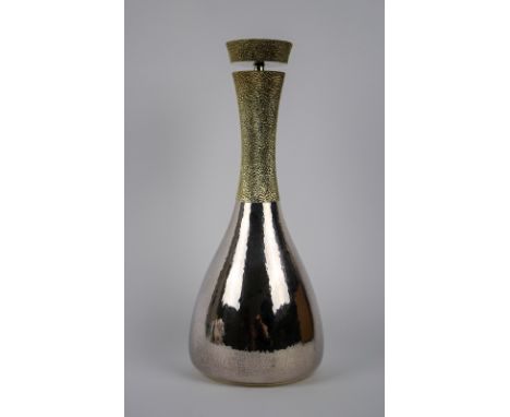 A silver and silver gilt Wine decanter, marked London 1977, Markers mark for Richard Lawrence Geere. together in a fitted cas