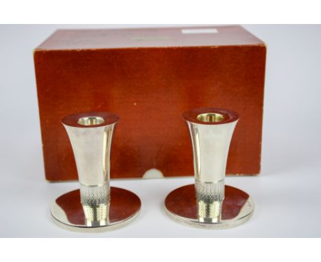 A pair of silver dwarf candlesticks , marked London 1977, Markers mark for Richard Lawrence Geere. approx.200 grams.  Provena